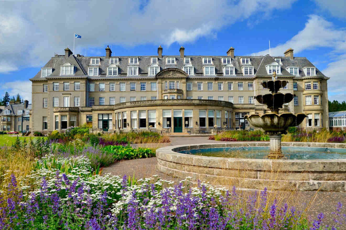 a large hotel building with a fountain in front of it