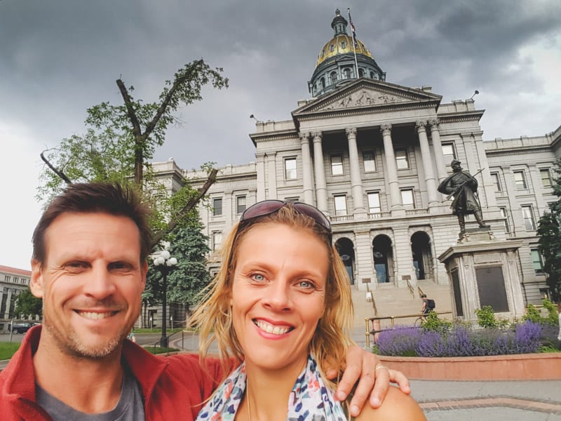 caz and craig posing outside City Hall Denver