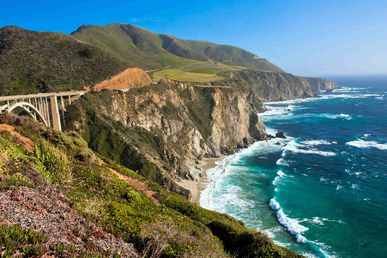 a scenic view of the ocean and a bridge