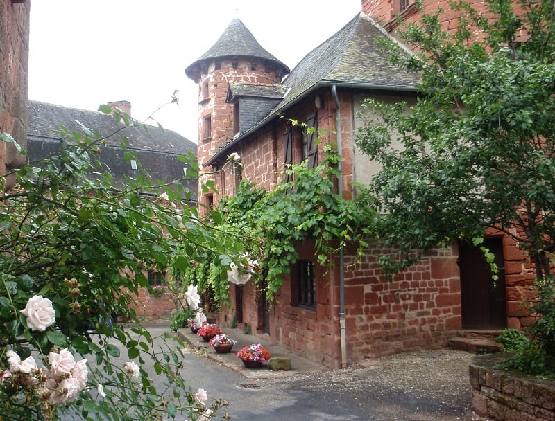 rose garden in front of Collonges la Rouge France