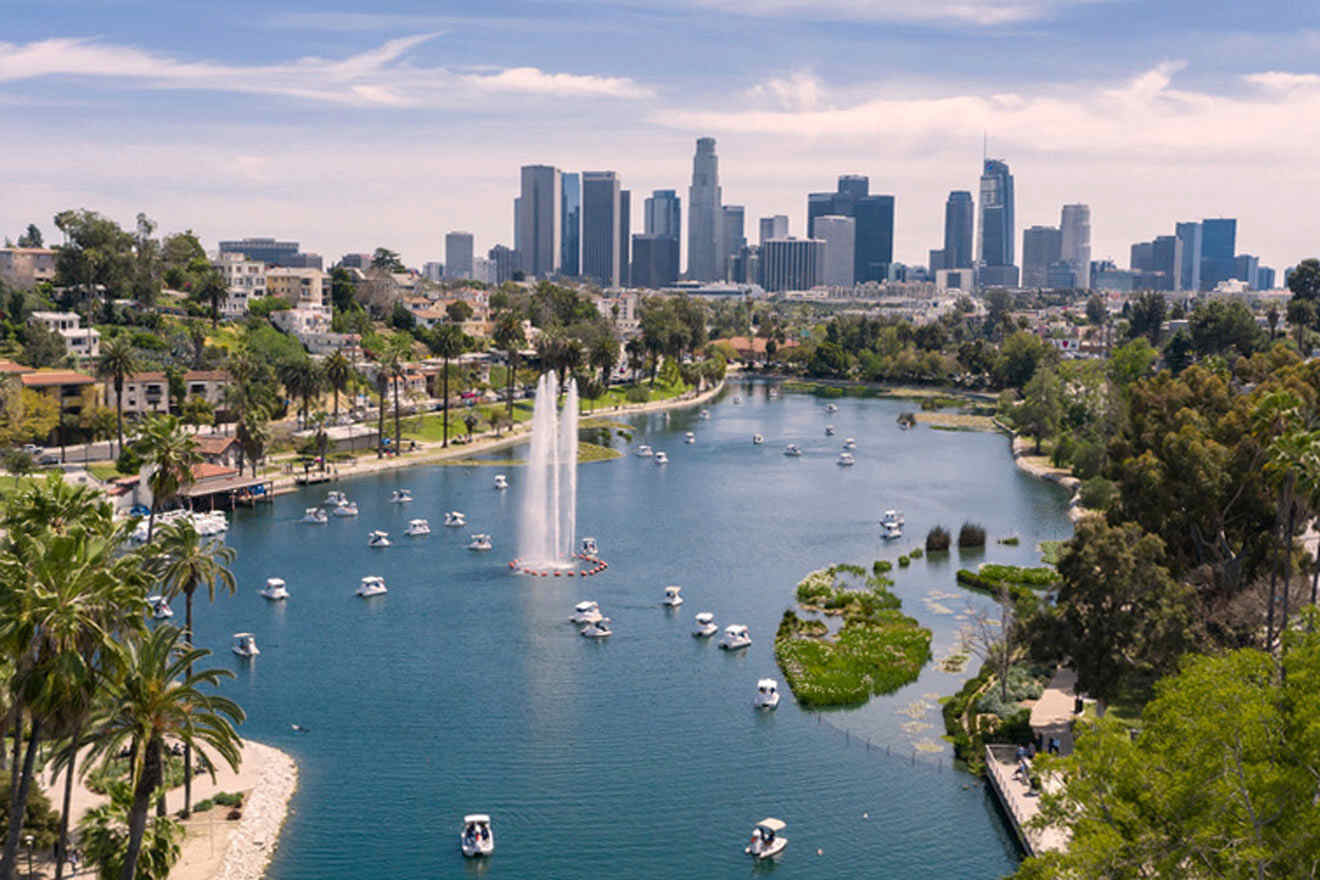 a view of a lake with boats in it and a city in the background