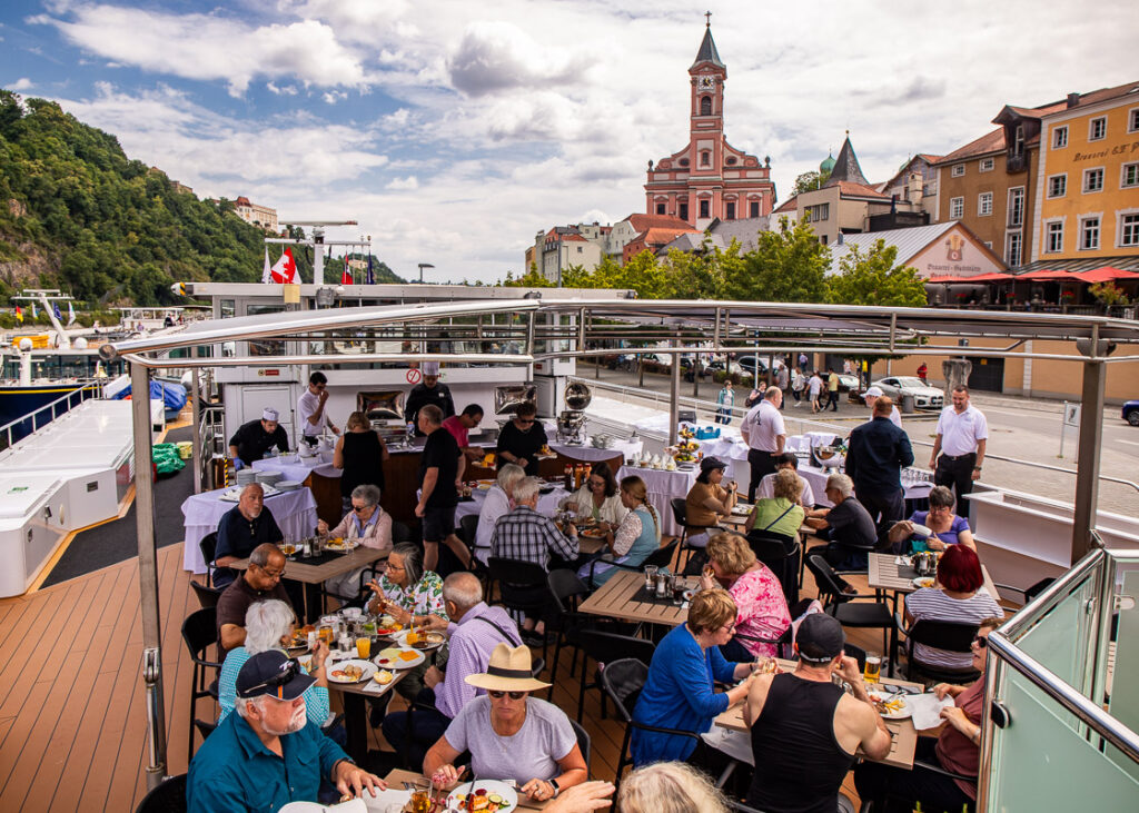 People having lunch on the top deck of a cruise ship