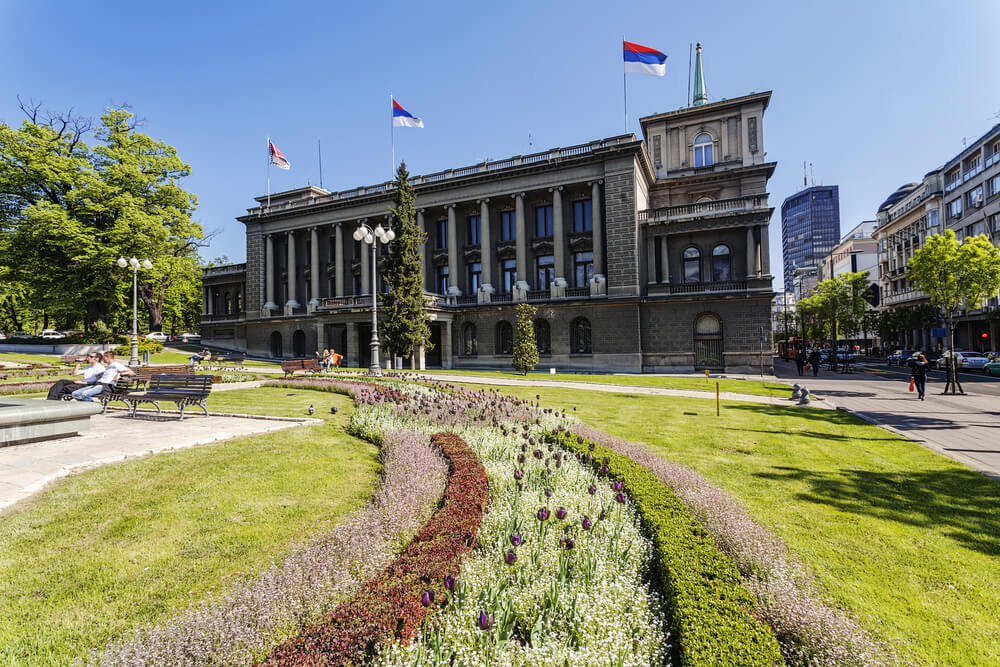 exterior of stari dvor palace with flag flying