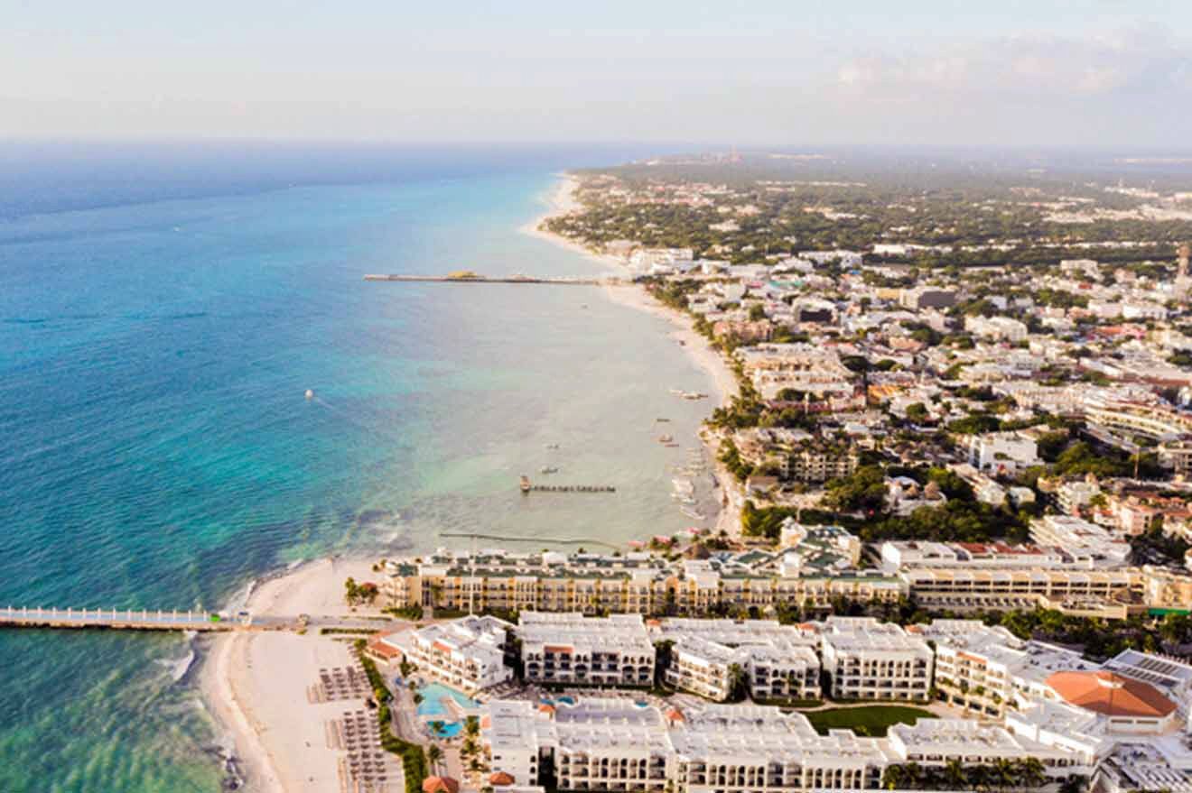 a bird's eye view of a beach and a city