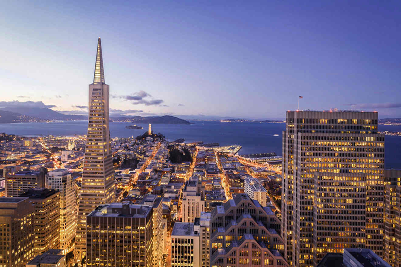 a view of a city at night from above the buildings