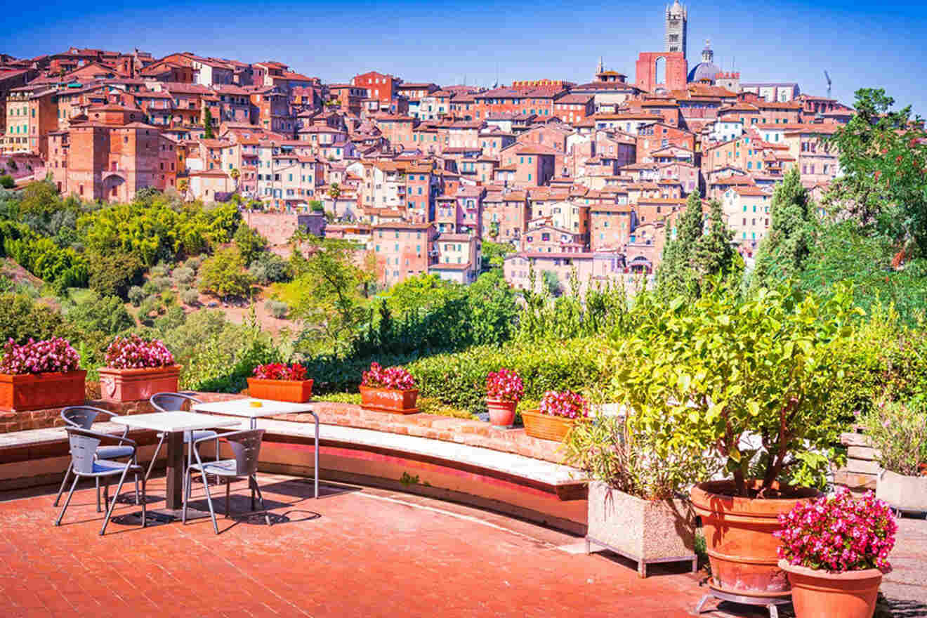 a table and chairs on a patio overlooking a city