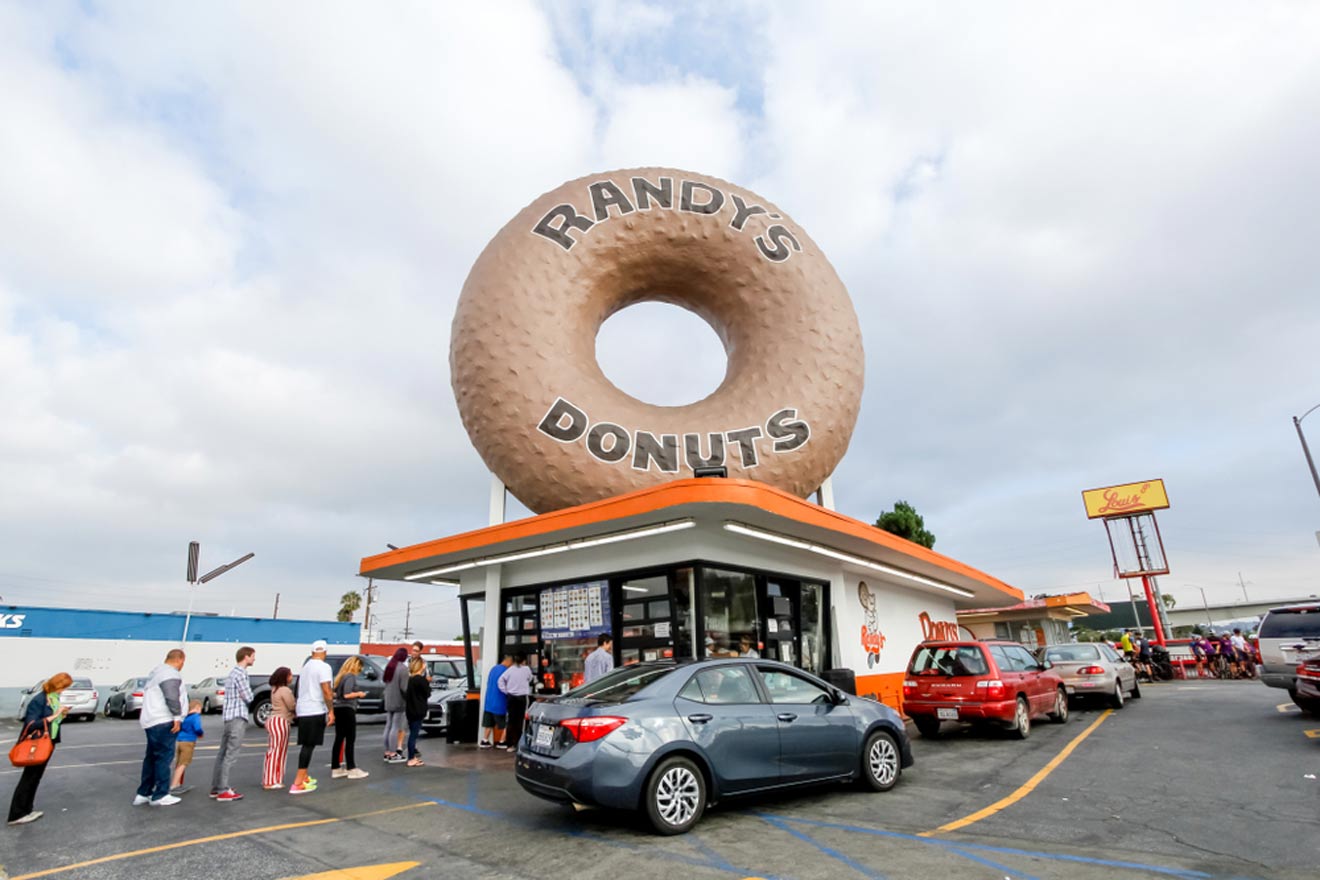 a donut shop with a giant donut on top of it