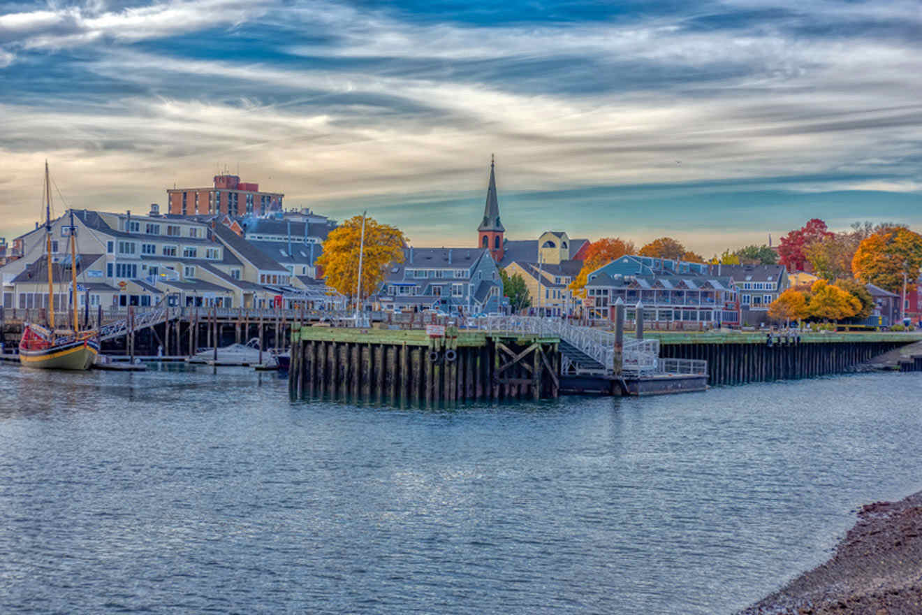 a harbor with boats and buildings in the background