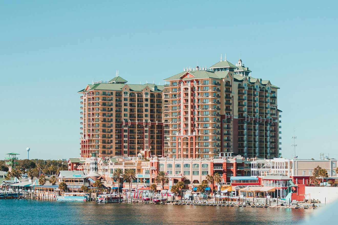 a large building sitting on the side of a body of water