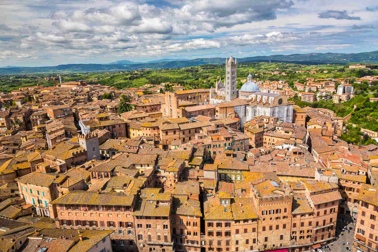 an aerial view of a city with orange buildings