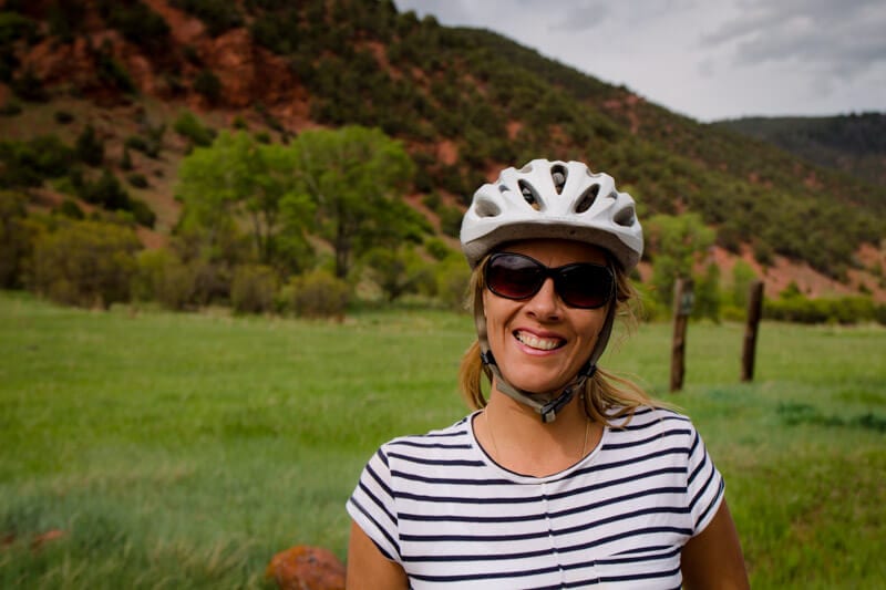 caz smiling at camera with helmet on