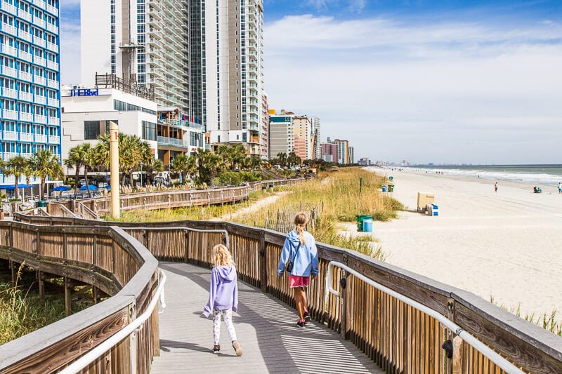 kalyra and savannah walking on myrtle beach boardwalk