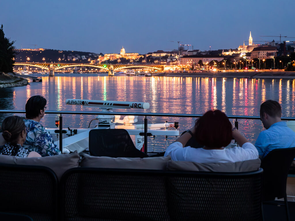 Sailing into a city on the river at night