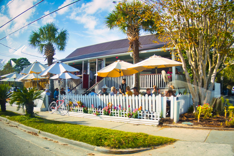 people on the terrace of a restaurant in a suburban neighborhood