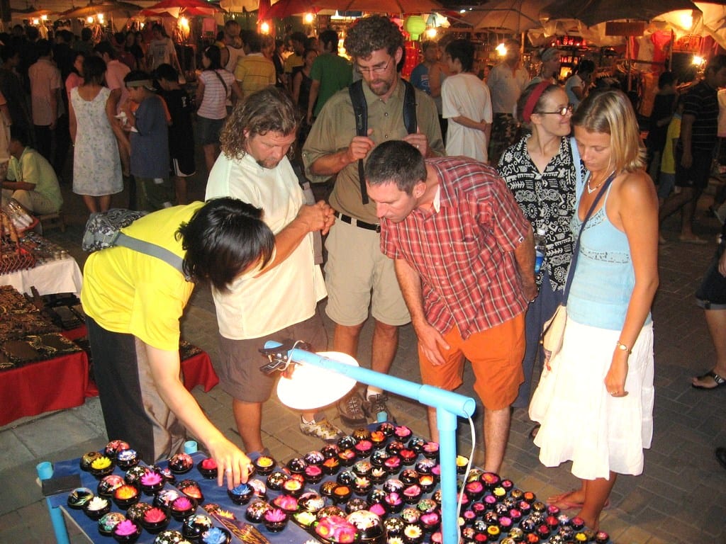 people shopping in markets at chiang mai thailand