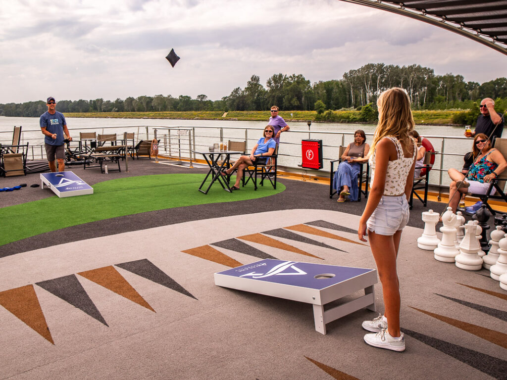 Dad and daughter playing corn hole