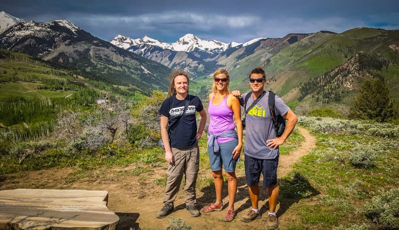 caz and craig with laurence posing in front of moujntains