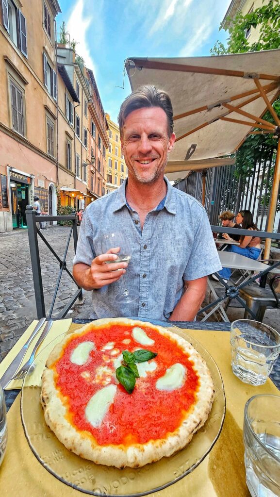 craig eating pizza and drinking wine