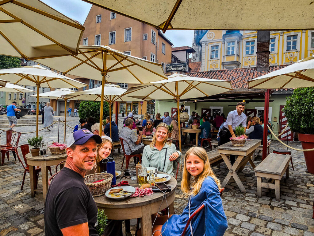 Family of four having lunch at a German sausage kitchen