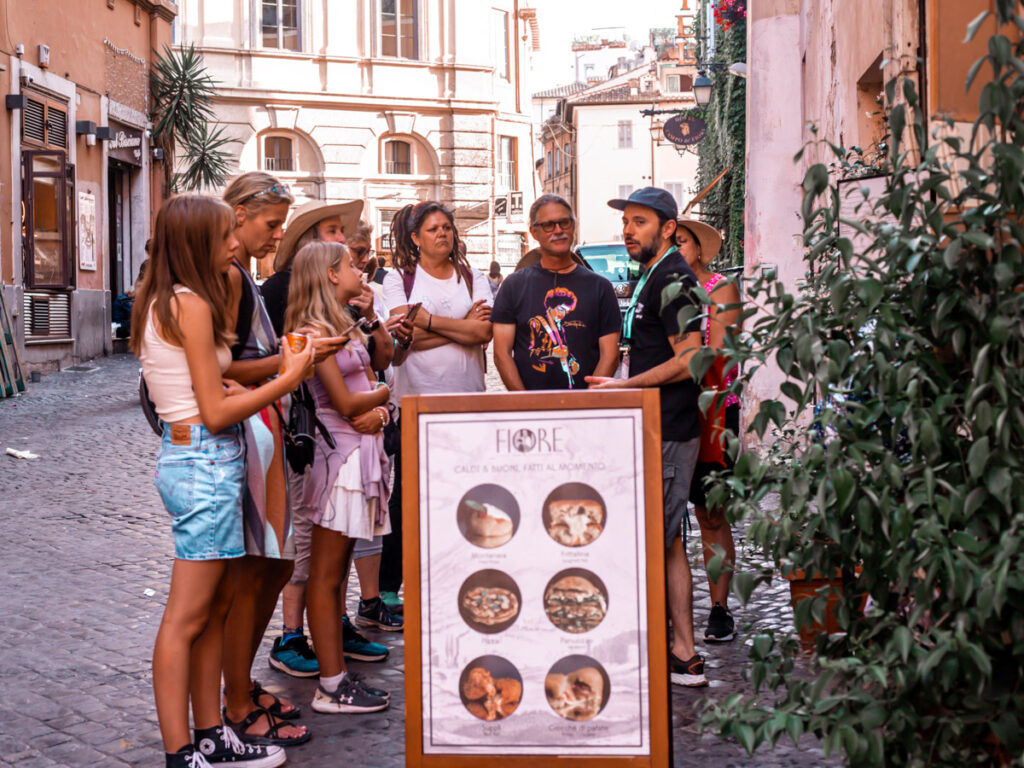 people standing around listening to tour guide