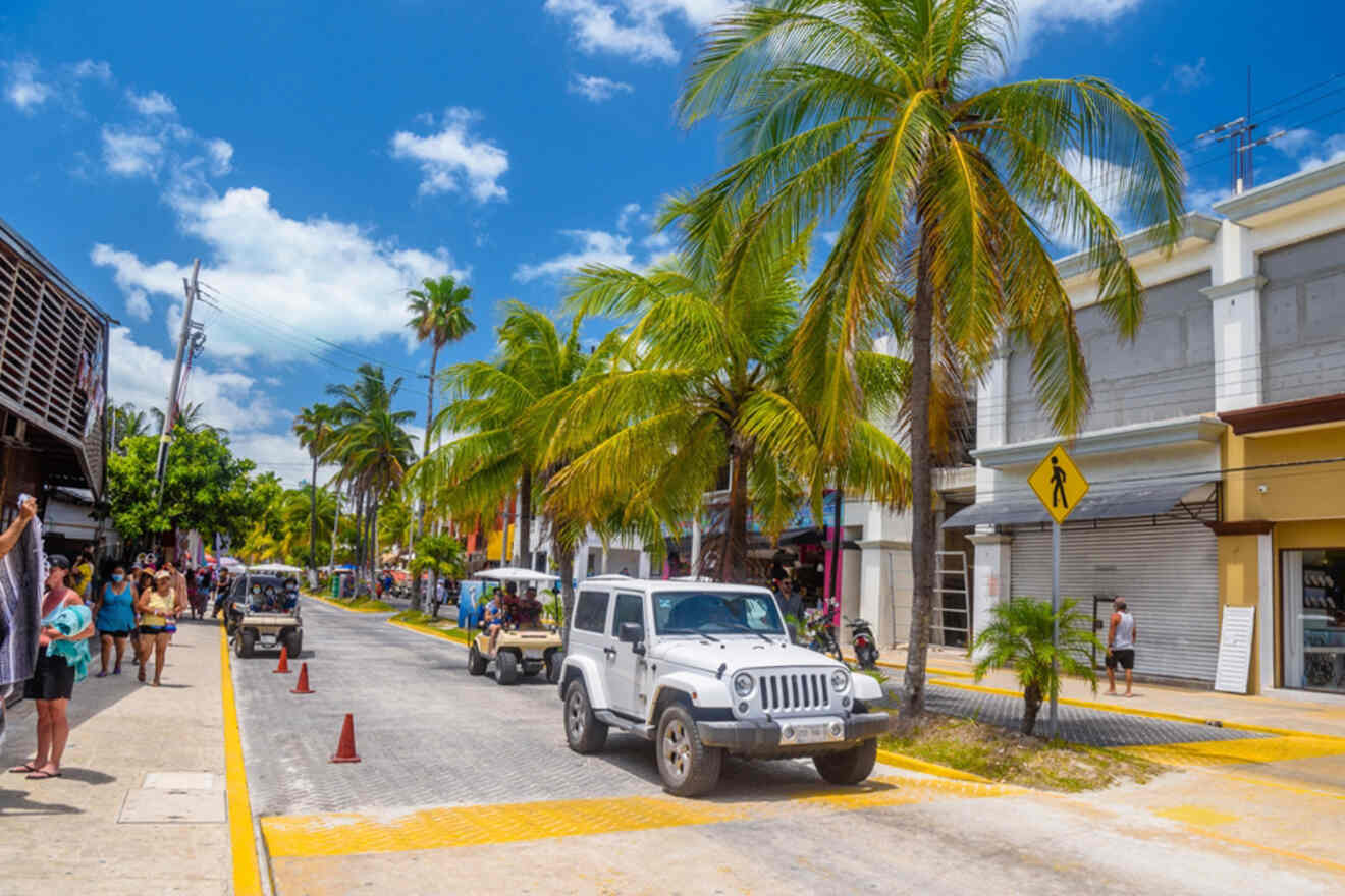 white jeep parked on a street with palm trees.