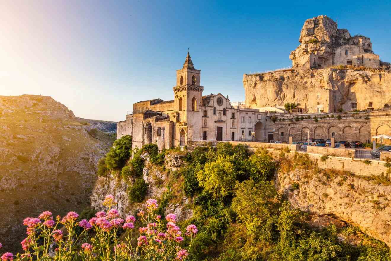 A city with a church on top of a cliff.