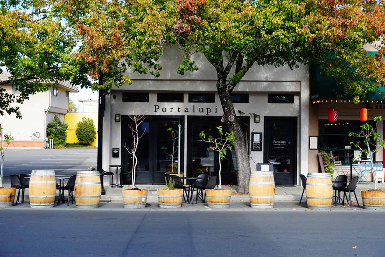 A group of barrels in front of a restaurant.