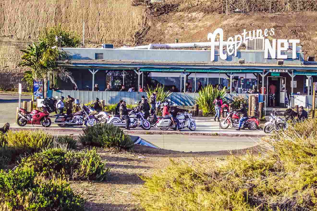 a pub with lots of parked motorcycles in front of it