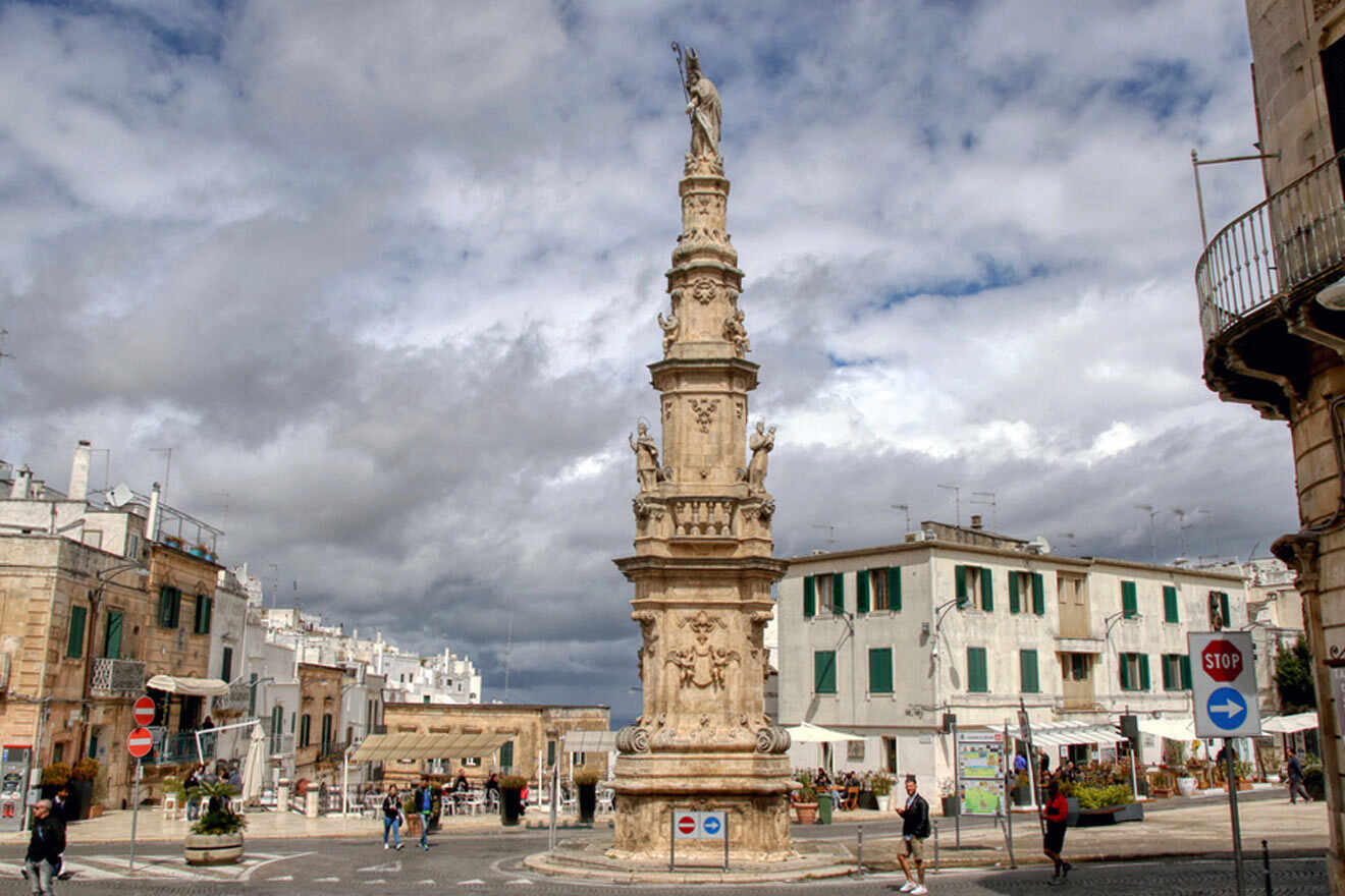 a tall tower sitting in the middle of a street