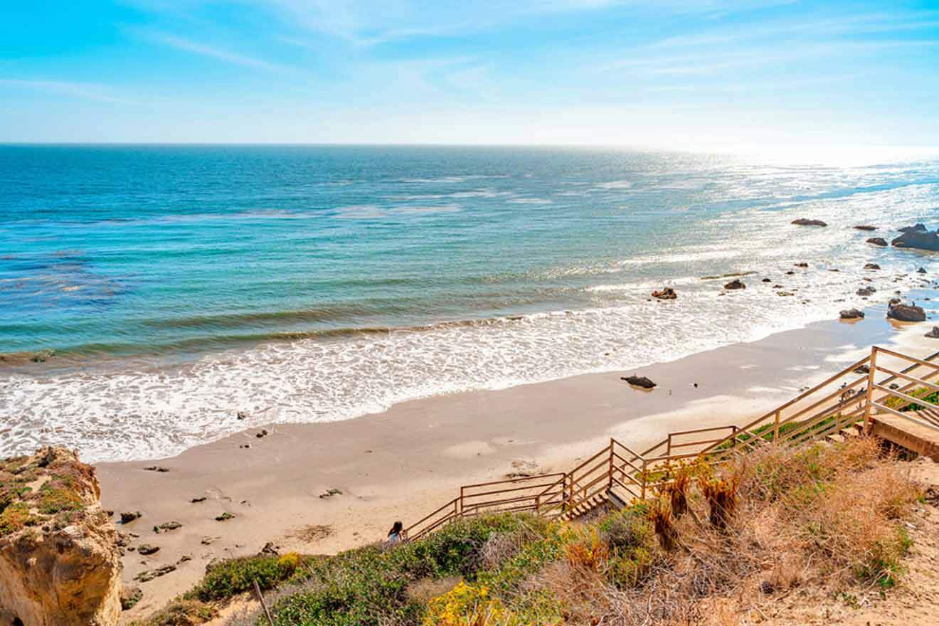 view of the beach with wooden stairs going towards the beach