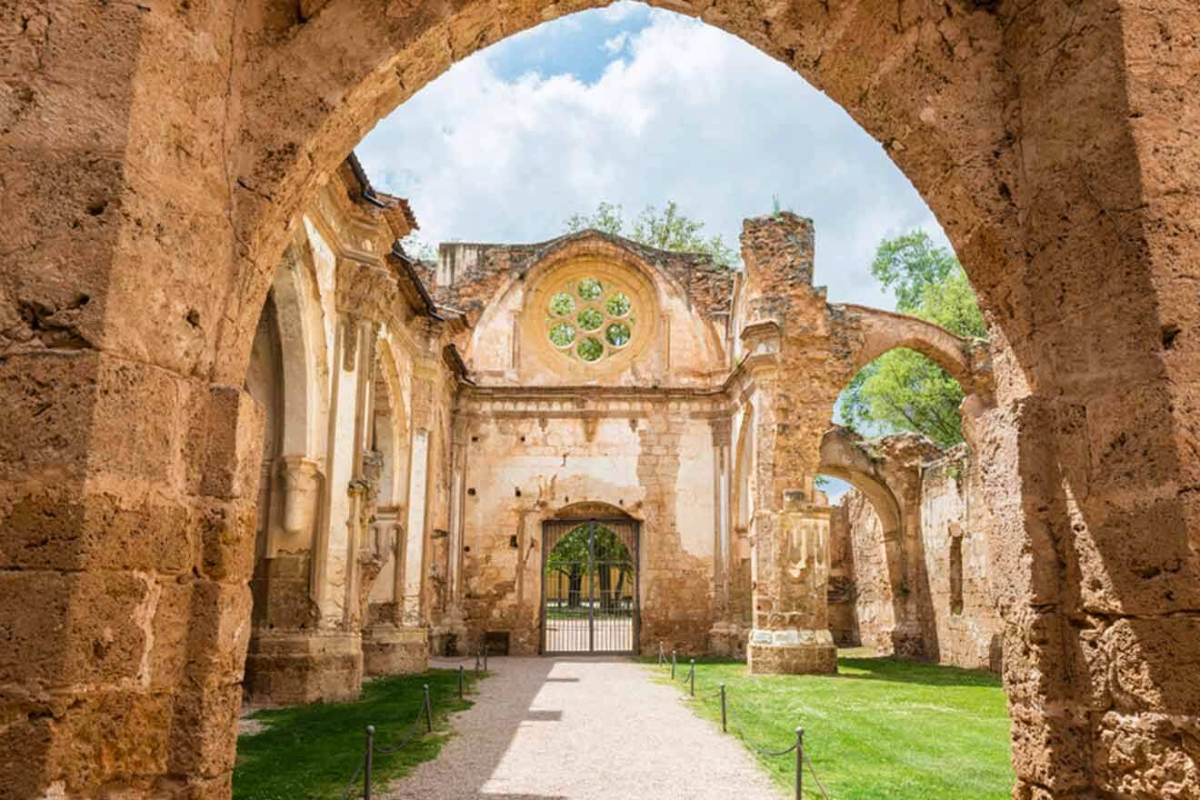 an archway leading to the ruins of a church