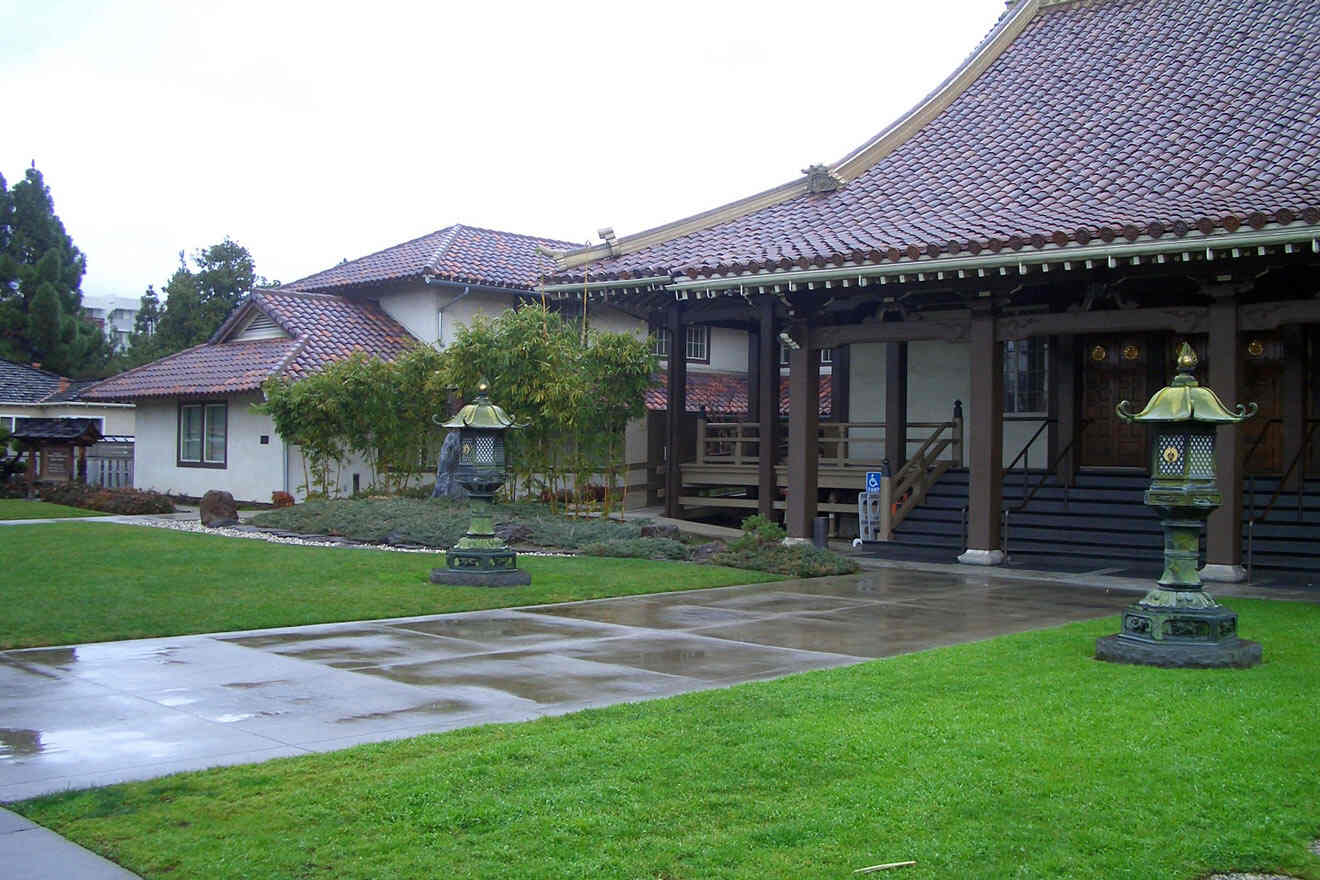 A building with a roof and grass in front of it