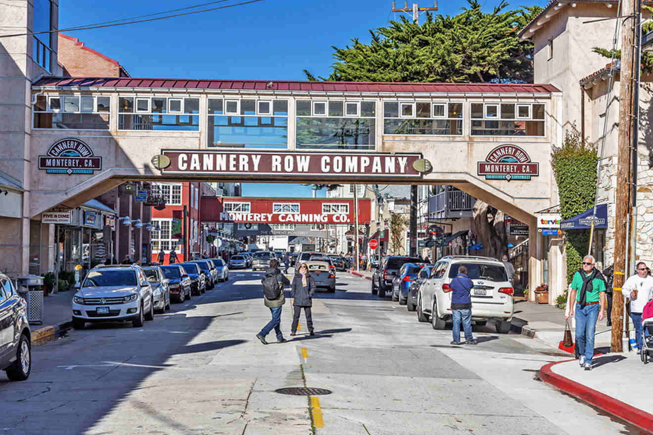 street with parked cars and people walking around