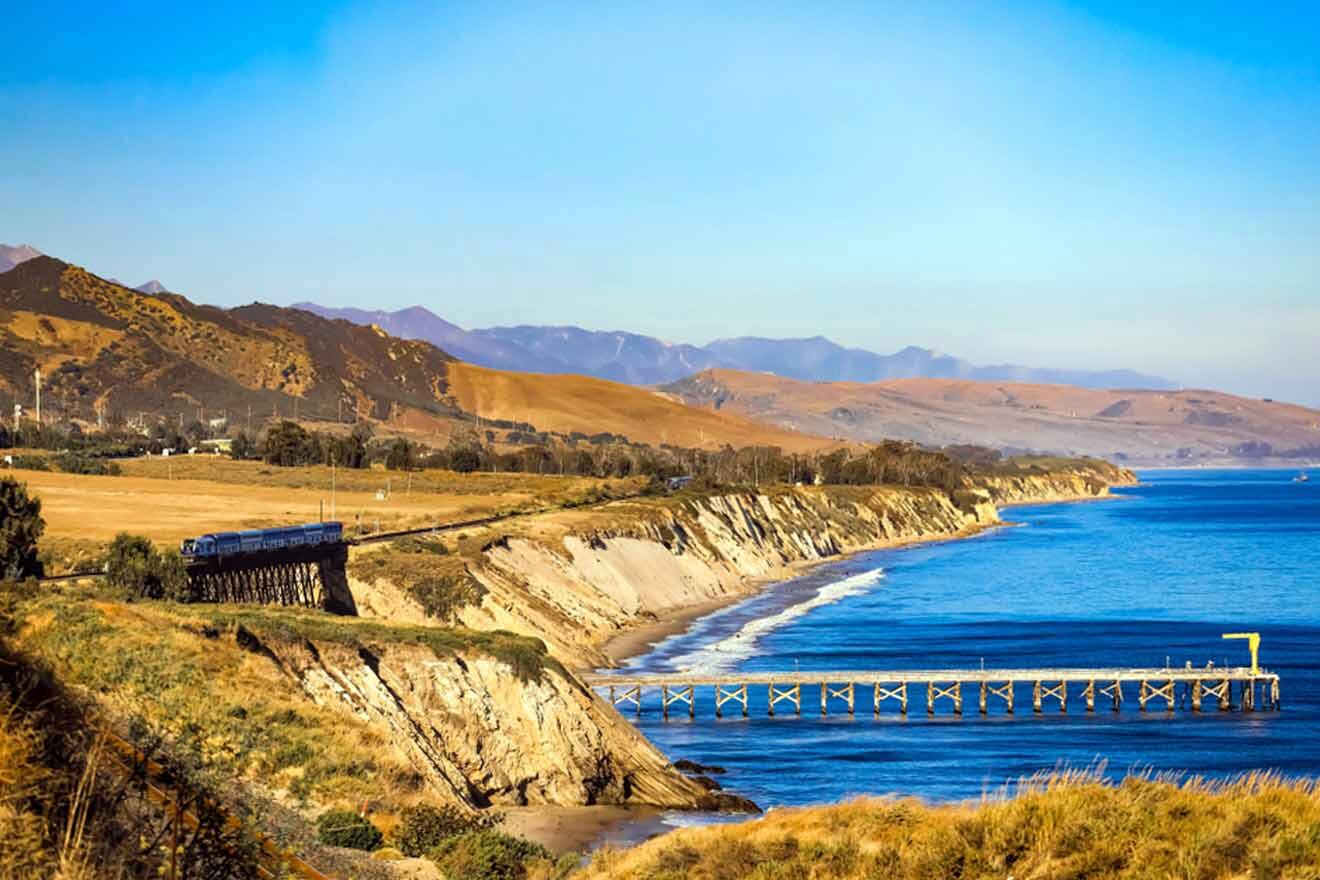 a train traveling over a bridge over a body of water