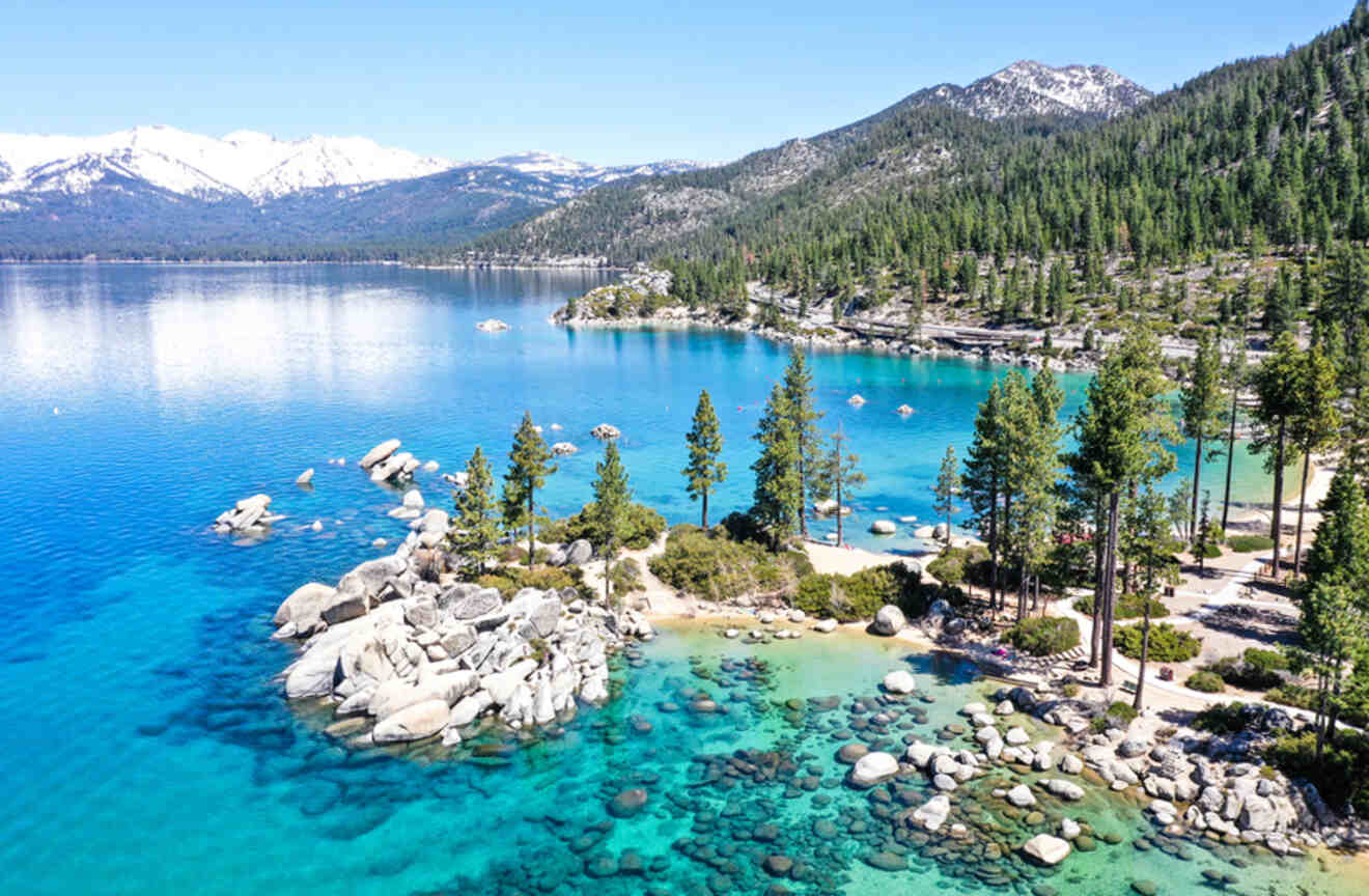 aerial view of a rocky beach on a lake with crystal clear water