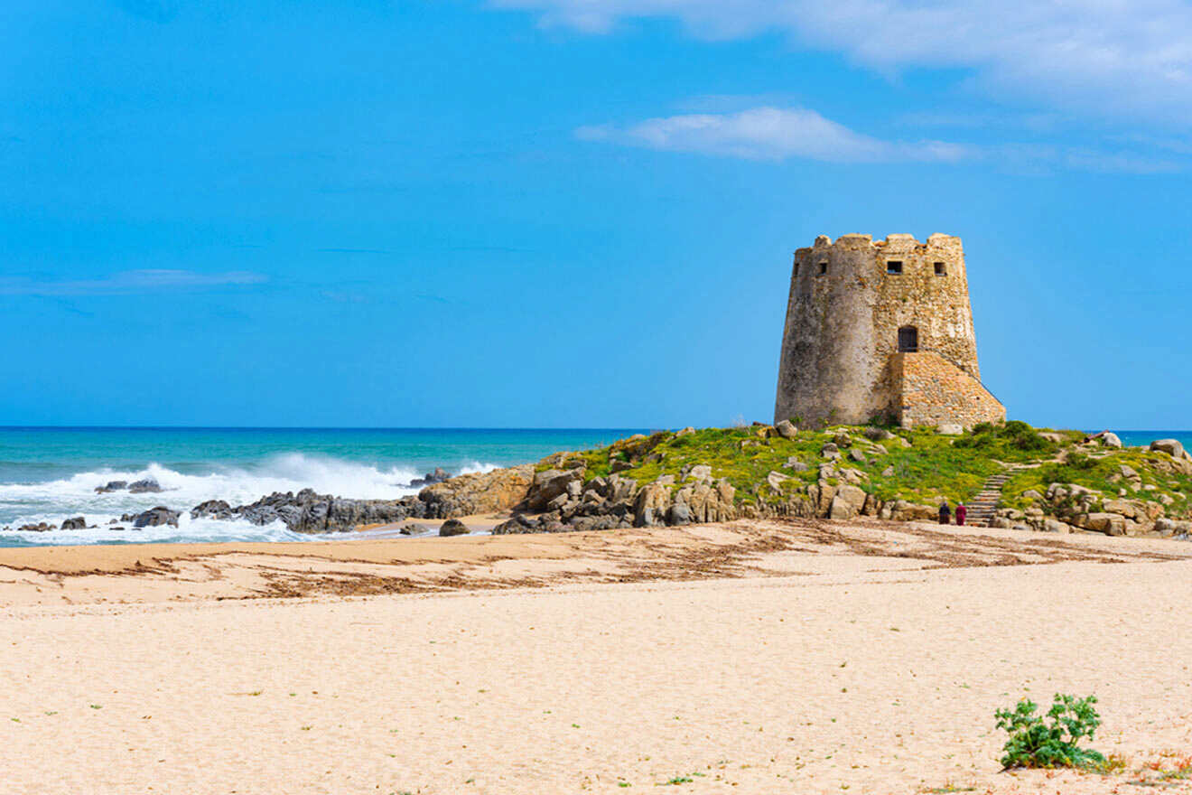 A tower on top of a sandy beach.