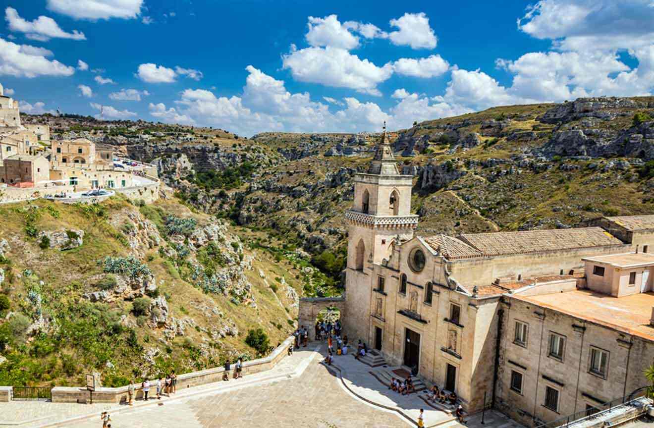 a view of a town from a high point of view with a church and tourists