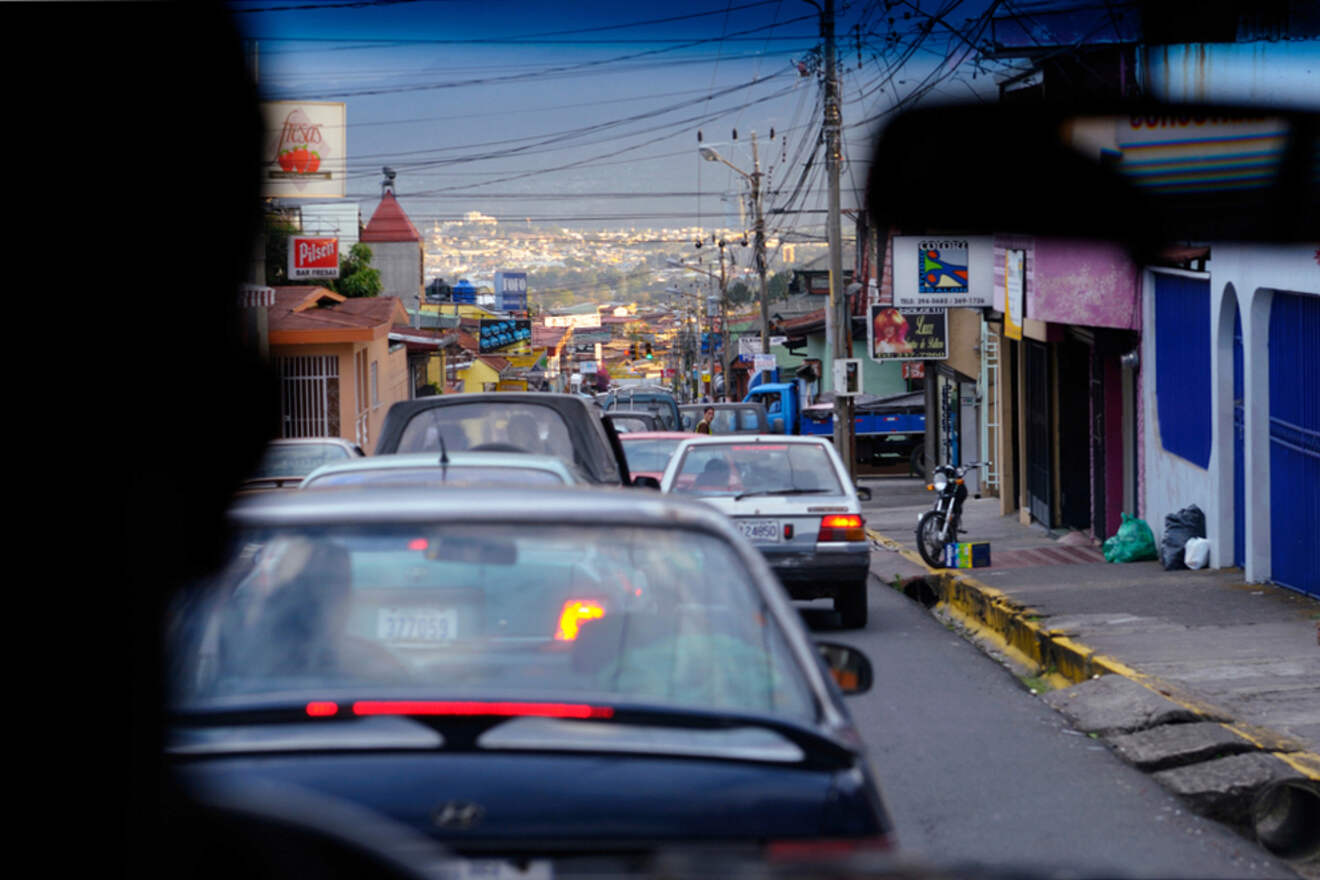 a lot of cars driving down a street