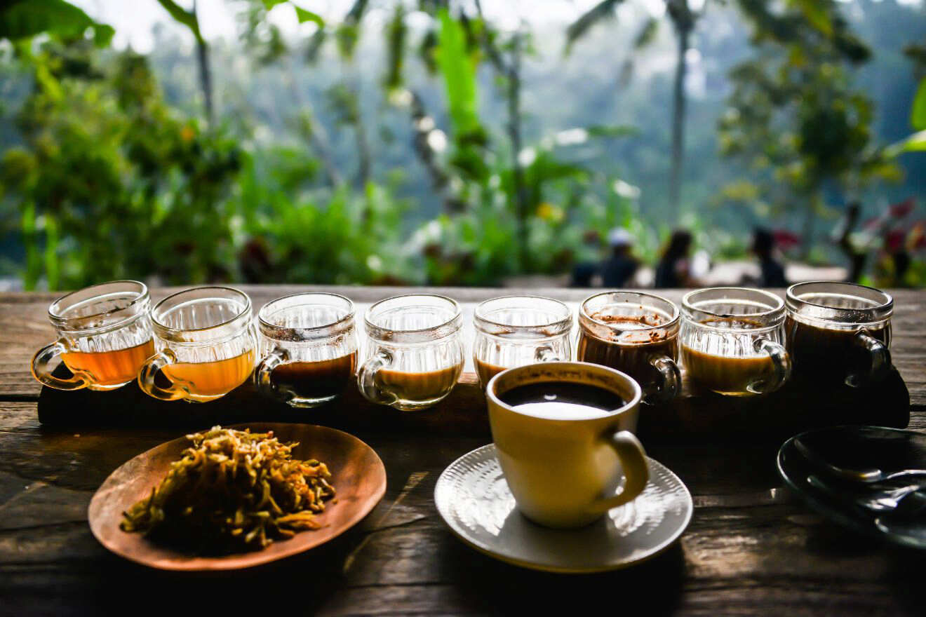 A tray of coffee on a wooden table.