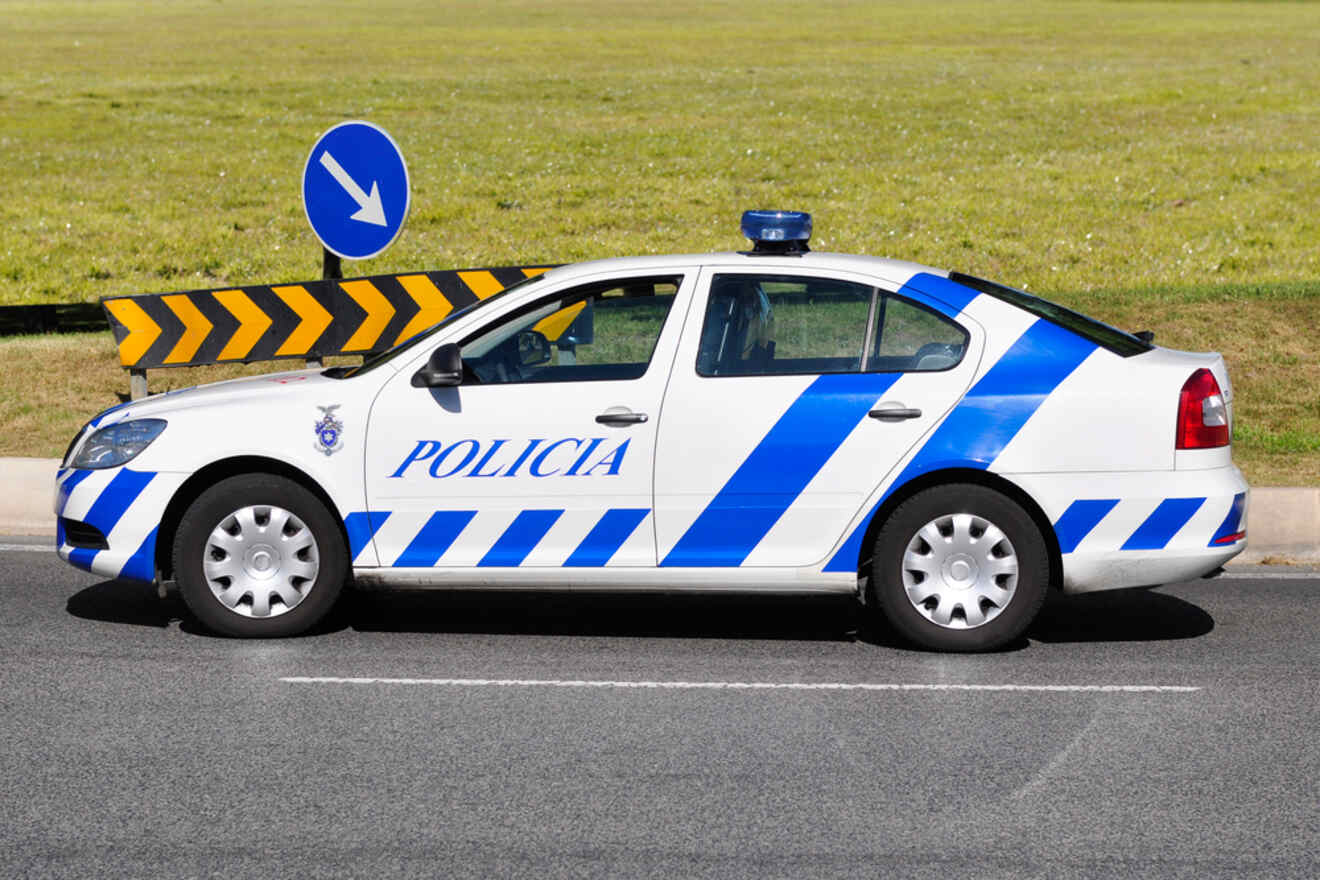 A police car is parked on the side of the road.