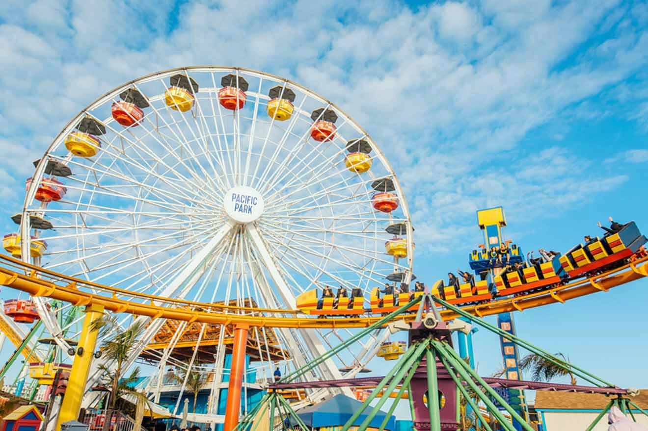 a carnival ride with a ferris wheel in the background