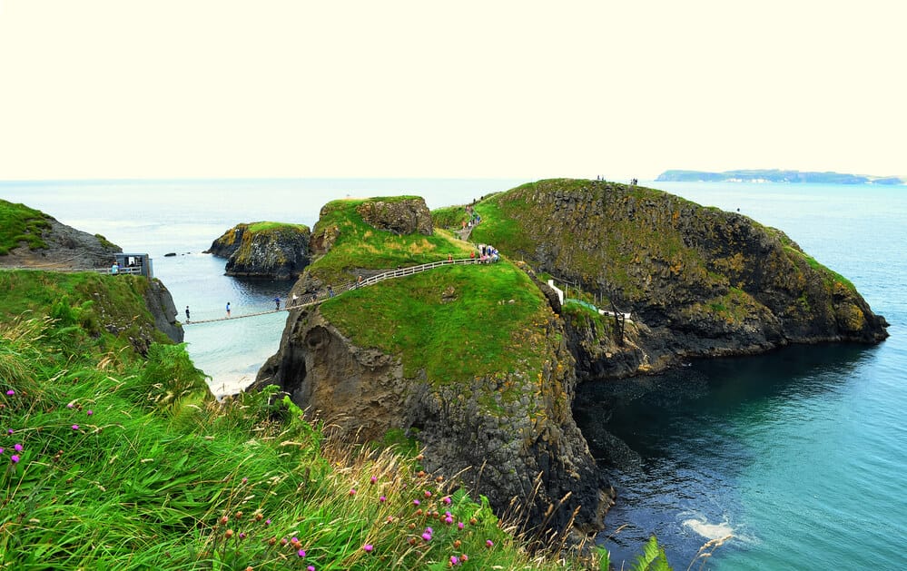 people walking Carrick a Rede Rope Bridge