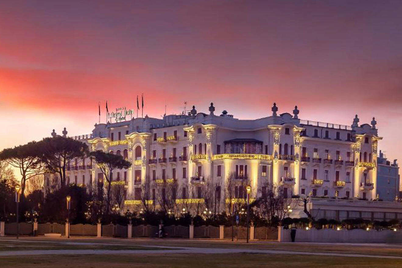 hotel's building at night surrounded by trees