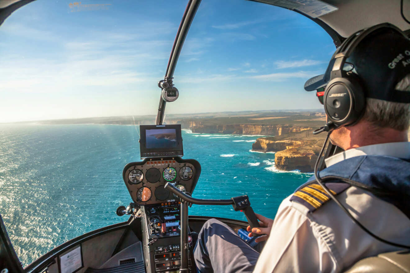 a helicopter flying over the ocean