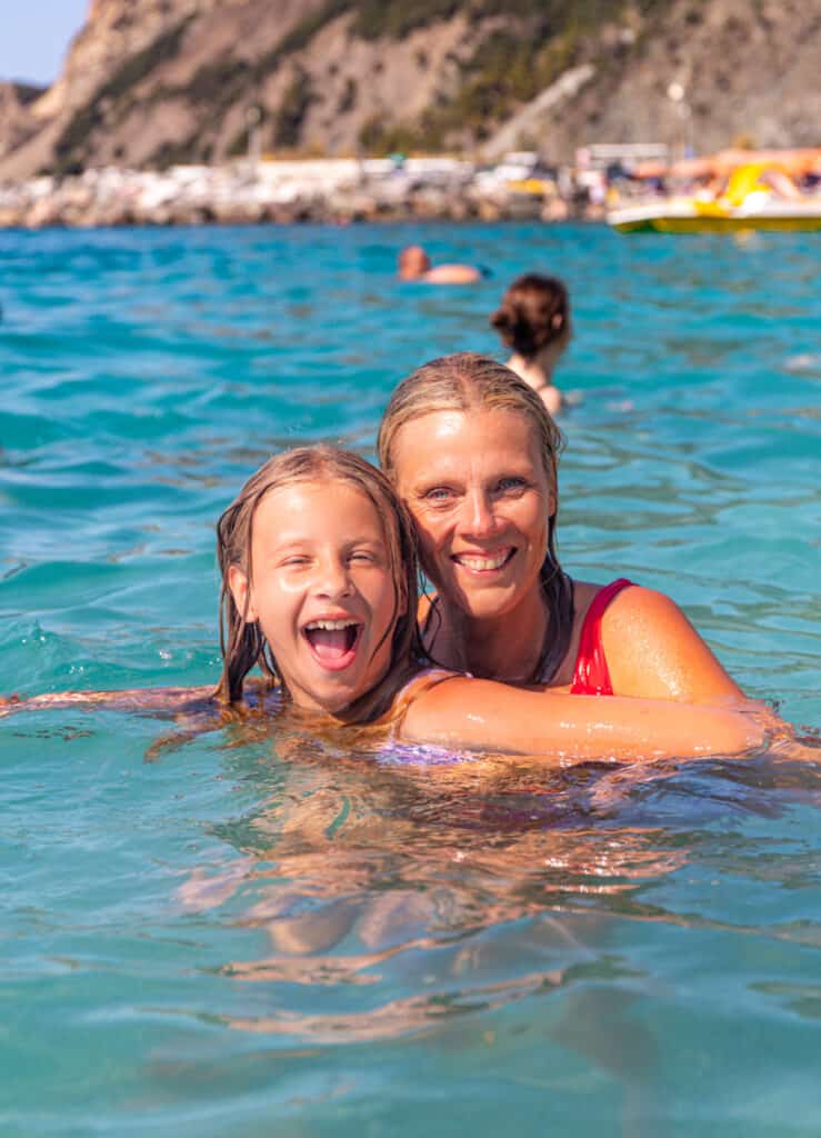 caz and savannah swimming in the beach