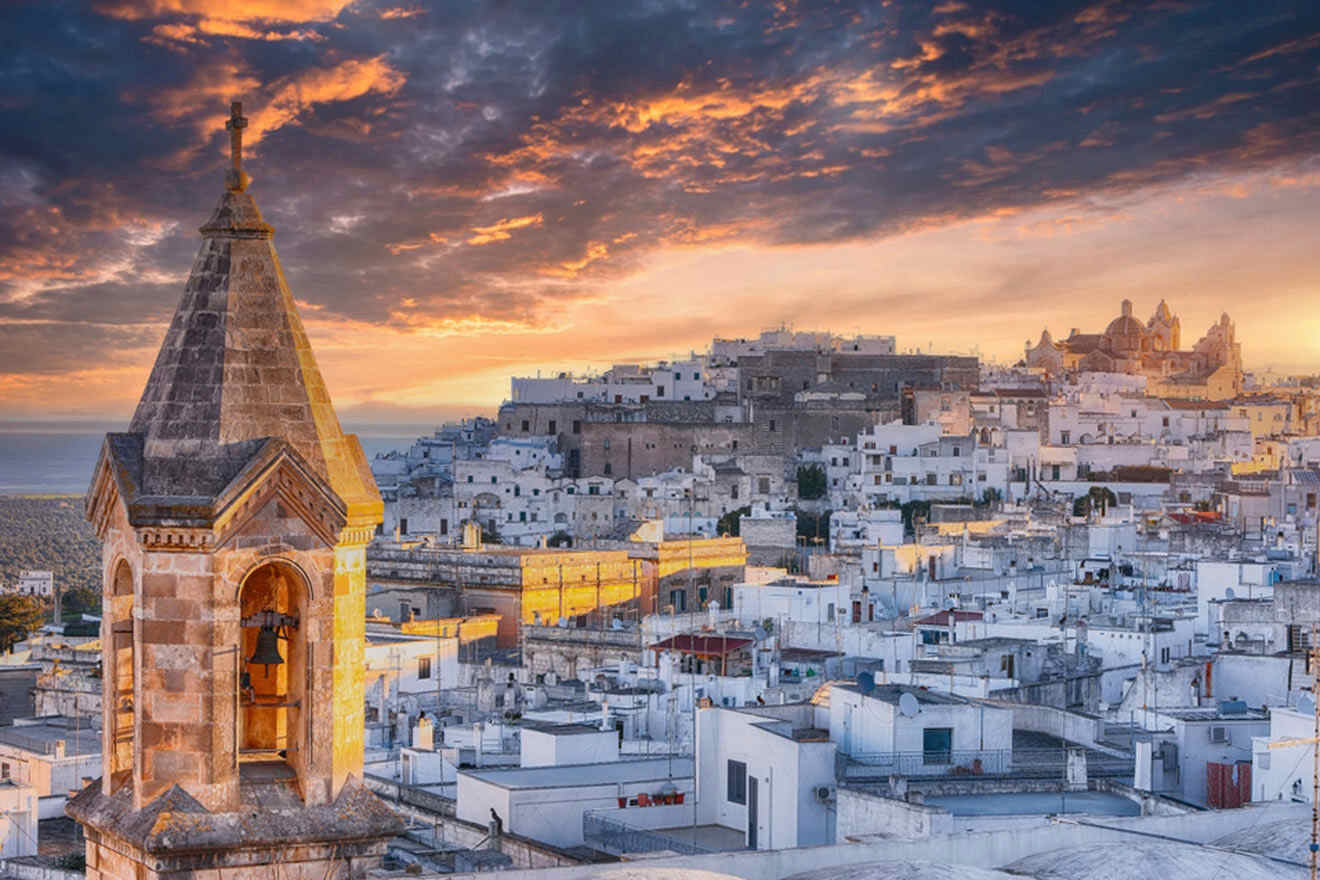 a view of a city at sunset with a tower