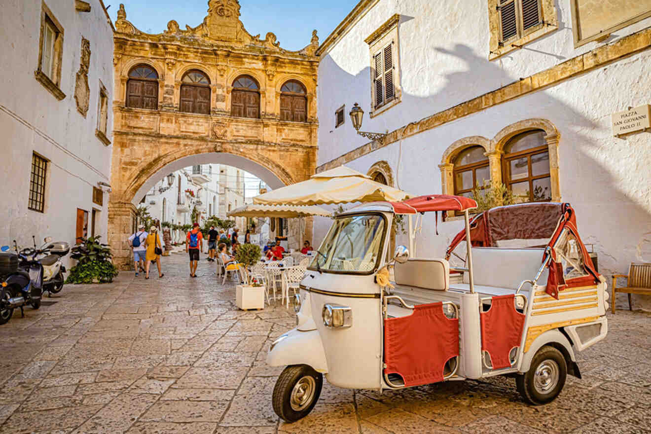 a tuk tuk parked in front of a building