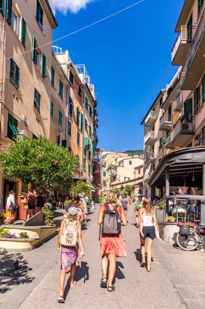 caz and girls walking down street in Riomaggiore 