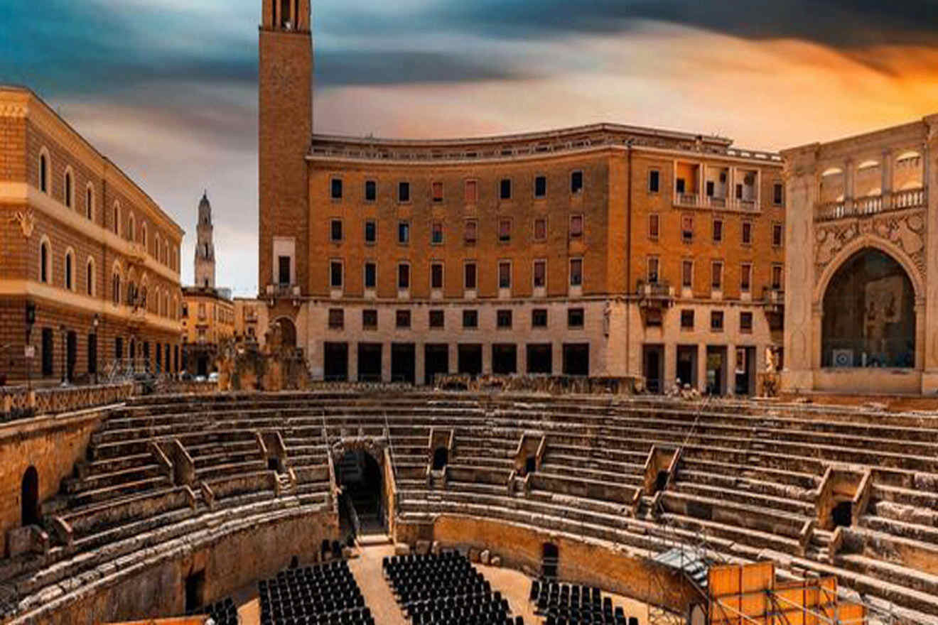 An ancient theater in the middle of a city.