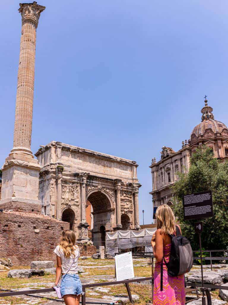 caz and savannah looking athte The Column of Phocas next to the arch of septimius